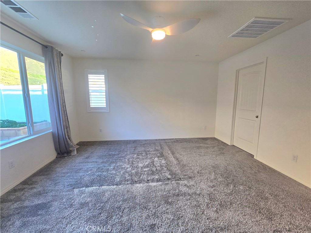 6451 Canyonlands Drive Jurupa Valley, CA 92509 - Photo 6 of 23 a view of an empty room and window