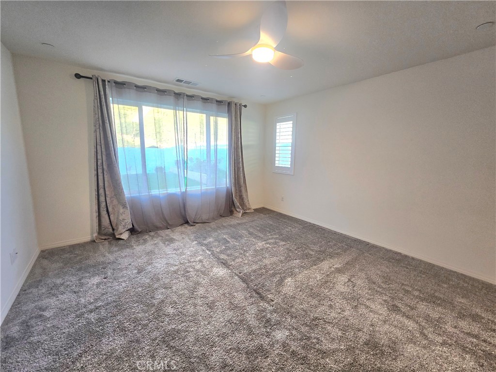 6451 Canyonlands Drive Jurupa Valley, CA 92509 - Photo 7 of 23 an empty room with windows