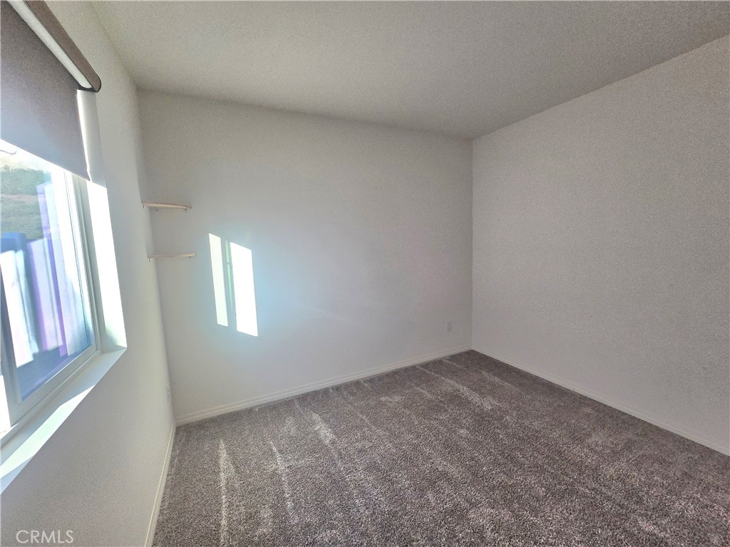 6451 Canyonlands Drive Jurupa Valley, CA 92509 - Photo 10 of 23 an empty room with windows