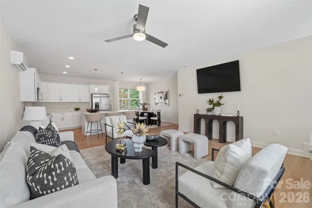 a living room with furniture or couch and a potted plant