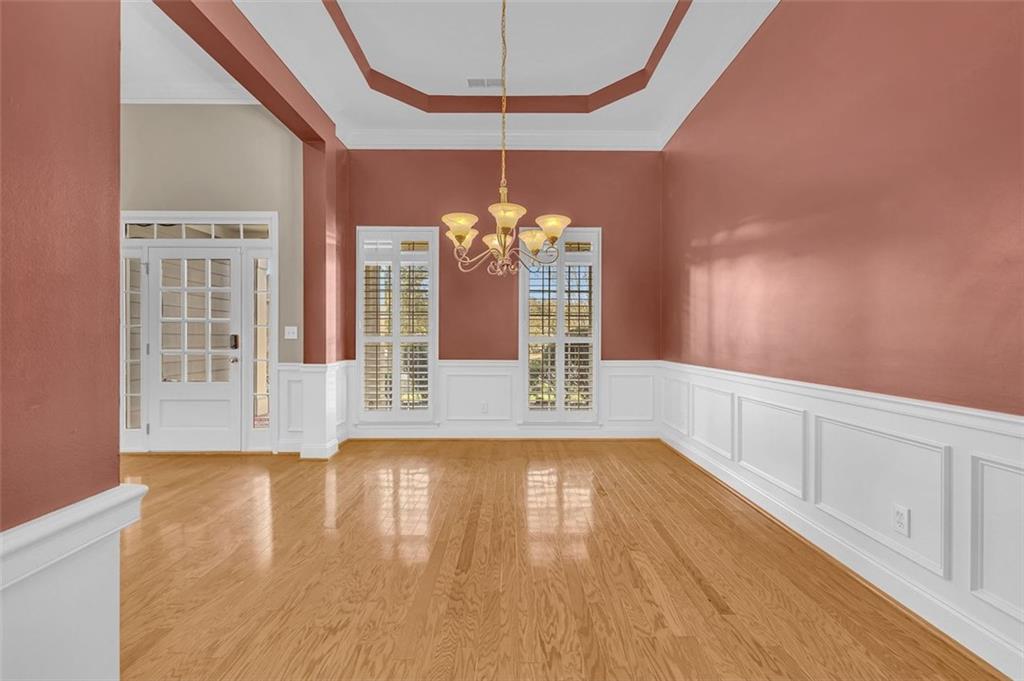 2403 Bonshaw Lane Southwest Marietta, GA 30064 - Photo 11 of 47 a view of a room with wooden floors and chandelier
