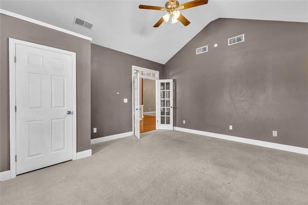 2403 Bonshaw Lane Southwest Marietta, GA 30064 - Photo 13 of 47 a view of an empty room with a ceiling fan