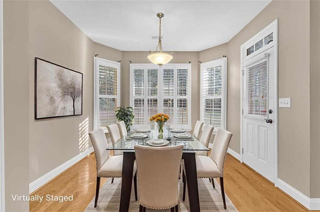 2403 Bonshaw Lane Southwest Marietta, GA 30064 - Photo 22 of 47 a view of a dining room with furniture window and wooden floor