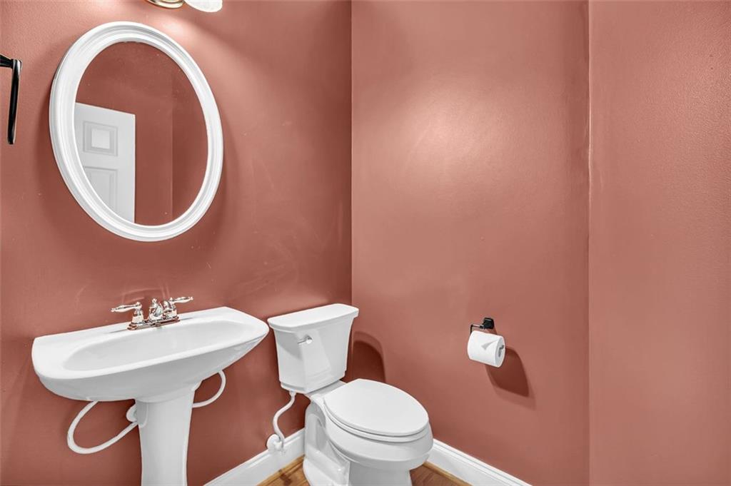 2403 Bonshaw Lane Southwest Marietta, GA 30064 - Photo 23 of 47 a bathroom with a toilet a sink and a mirror