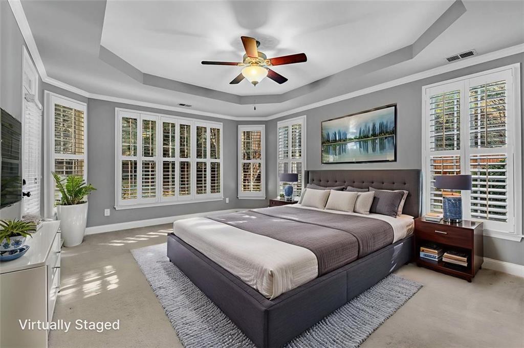 2403 Bonshaw Lane Southwest Marietta, GA 30064 - Photo 25 of 47 a spacious bedroom with a bed and a large window