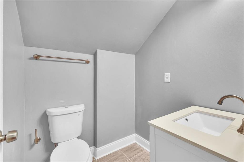 2403 Bonshaw Lane Southwest Marietta, GA 30064 - Photo 34 of 47 a white toilet sitting next to a bathroom sink