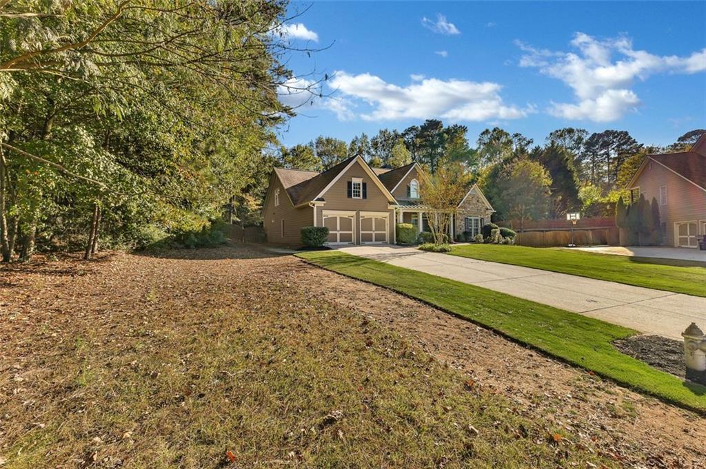 2403 Bonshaw Lane Southwest Marietta, GA 30064 - Photo 4 of 47 a view of house with yard and green space