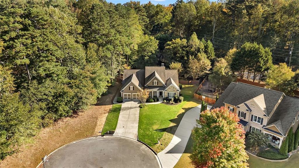 2403 Bonshaw Lane Southwest Marietta, GA 30064 - Photo 41 of 47 an aerial view of a house with a yard and large trees