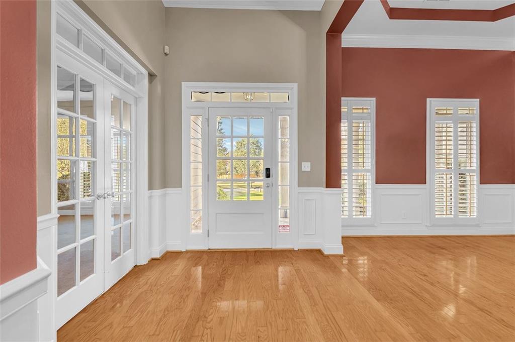 2403 Bonshaw Lane Southwest Marietta, GA 30064 - Photo 8 of 47 a view of an empty room with wooden floor and a window