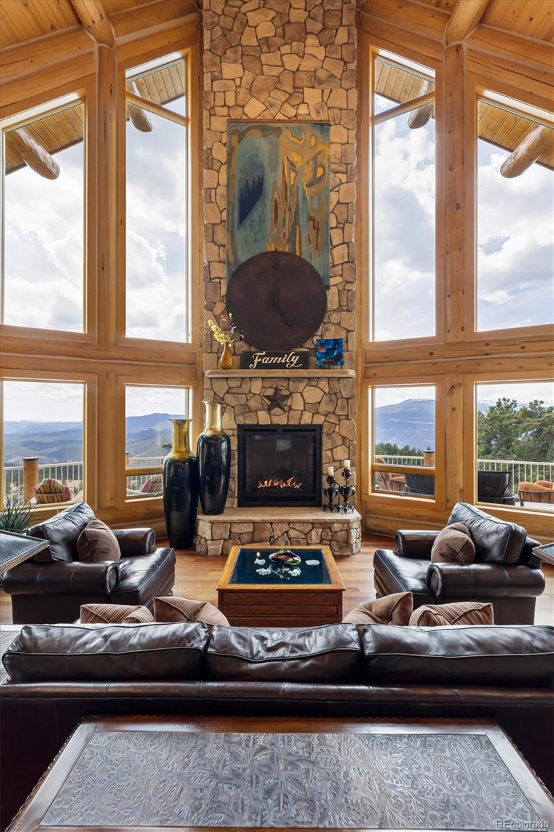 401 Raptor Point Golden, CO 80403 - Photo 15 of 48 a living room with furniture fireplace and a large window