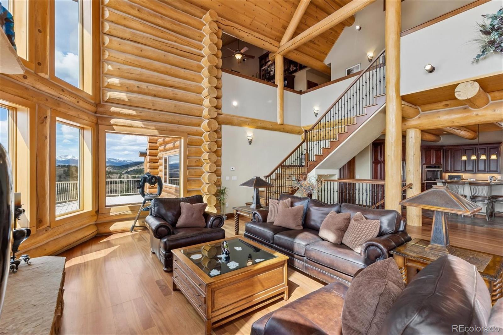401 Raptor Point Golden, CO 80403 - Photo 17 of 48 a living room with furniture a large window and wooden floor