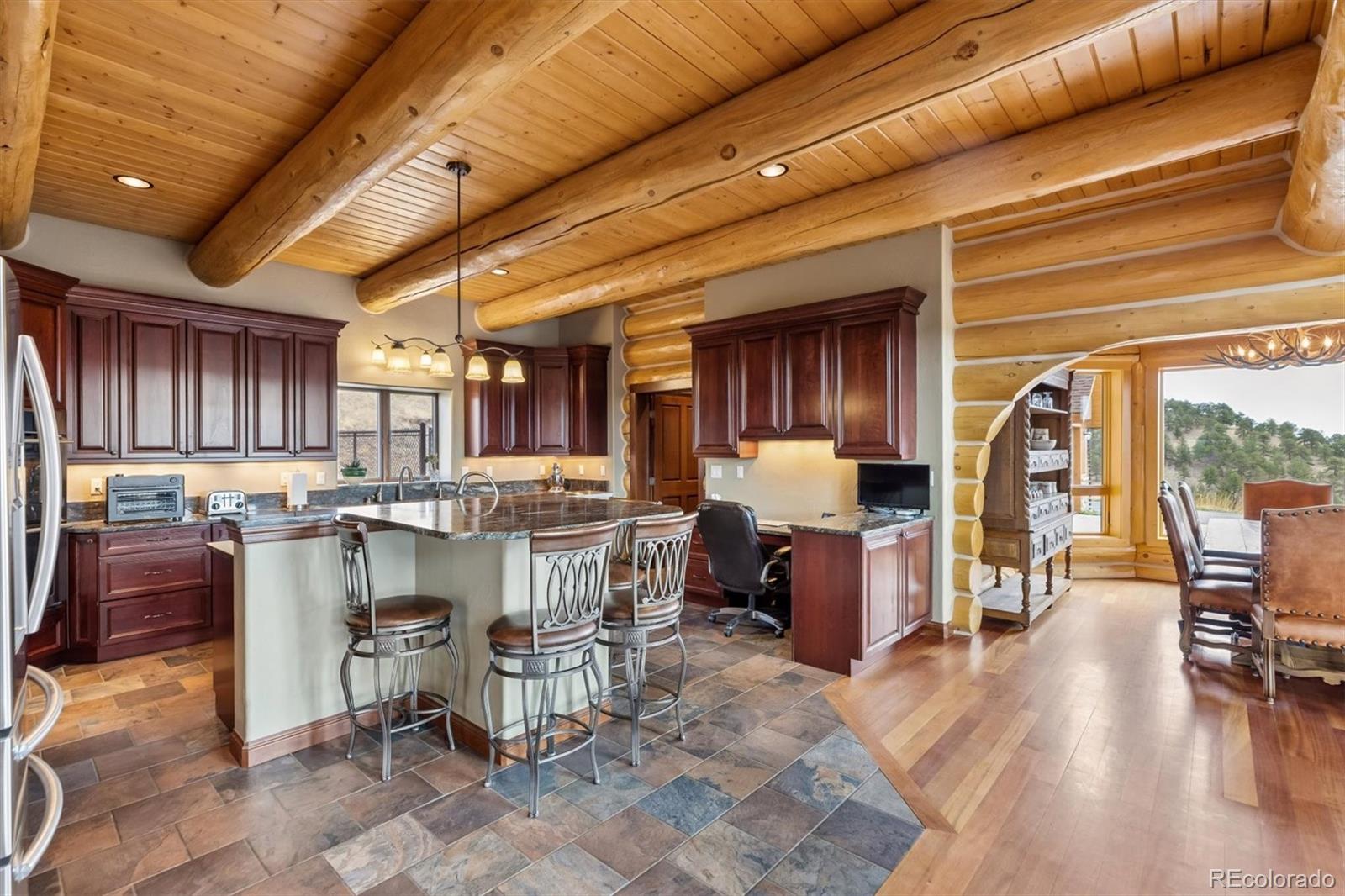 401 Raptor Point Golden, CO 80403 - Photo 19 of 48 a room with lots of wooden furniture and appliances