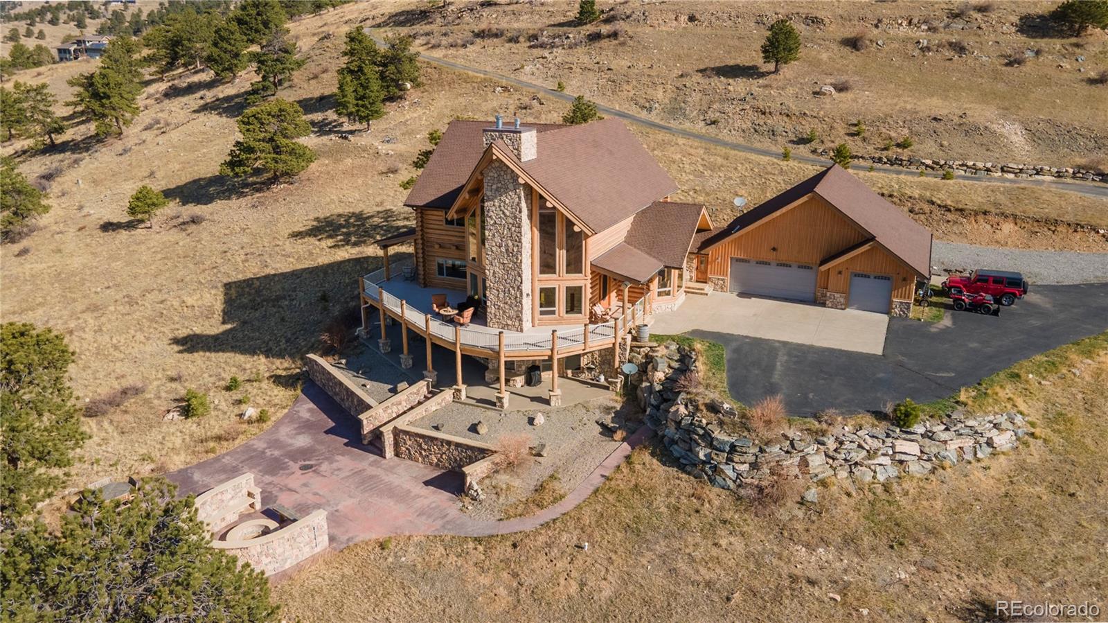 401 Raptor Point Golden, CO 80403 - Photo 2 of 48 an aerial view of a house with a yard