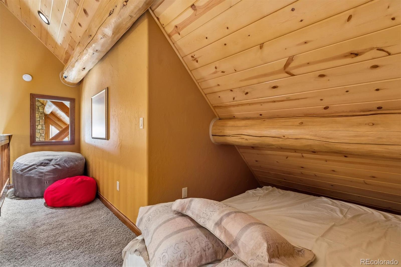 401 Raptor Point Golden, CO 80403 - Photo 34 of 48 a bed room with a bed and a painting on the wall