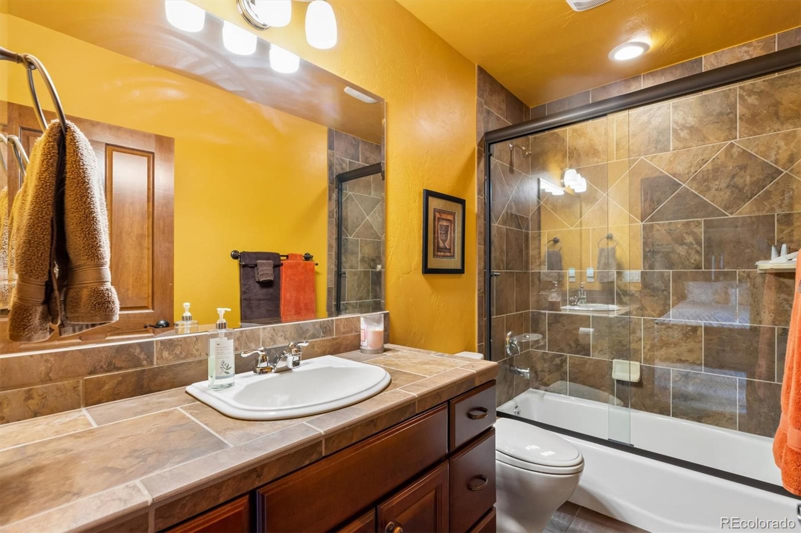 401 Raptor Point Golden, CO 80403 - Photo 36 of 48 a bathroom with a sink and a mirror