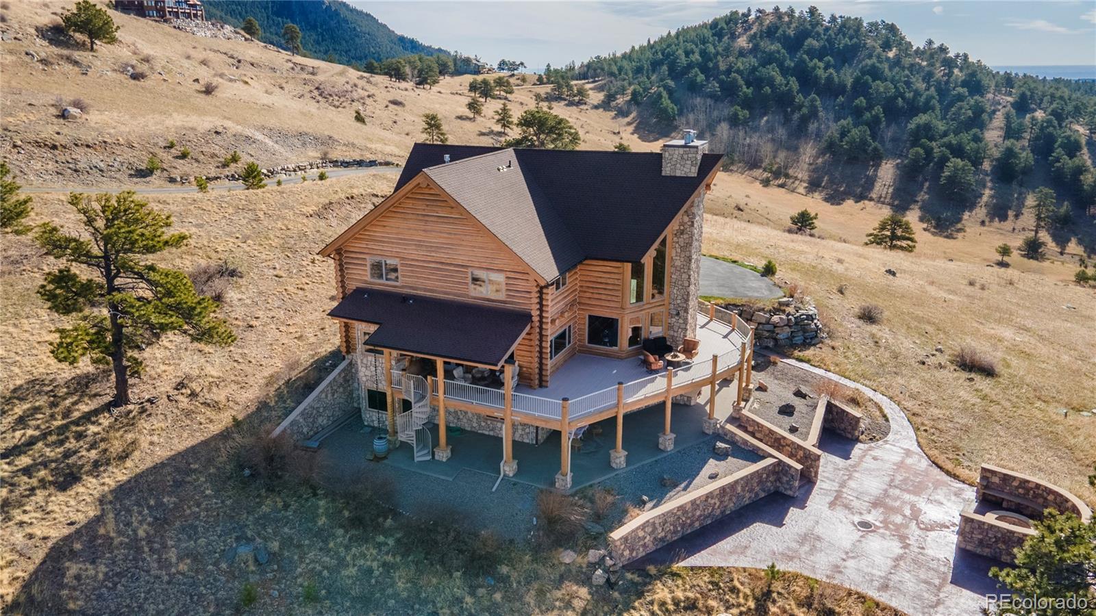 401 Raptor Point Golden, CO 80403 - Photo 4 of 48 a aerial view of a house with a yard and sitting area