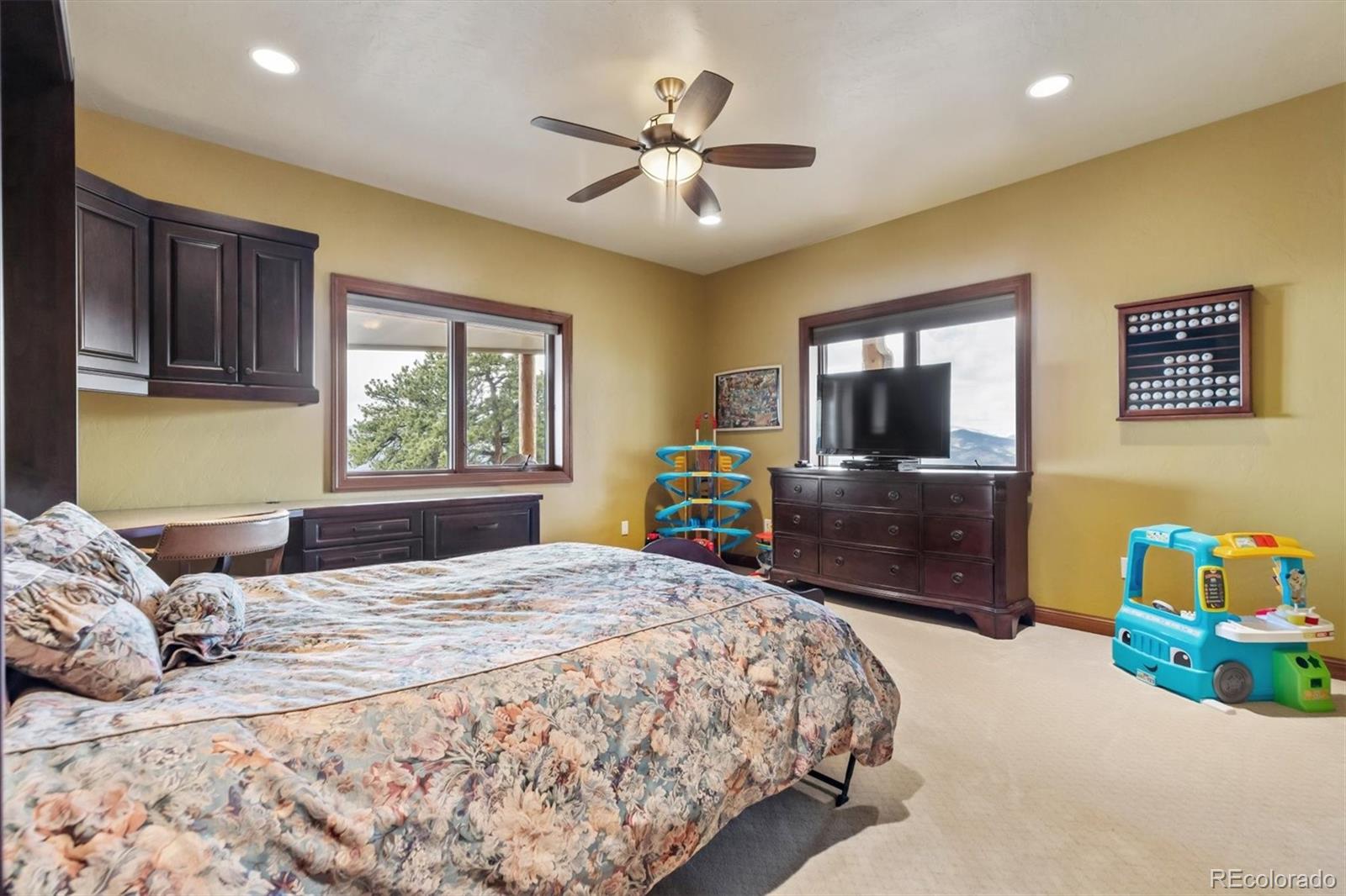 401 Raptor Point Golden, CO 80403 - Photo 44 of 48 a bedroom with a bed and wooden floor