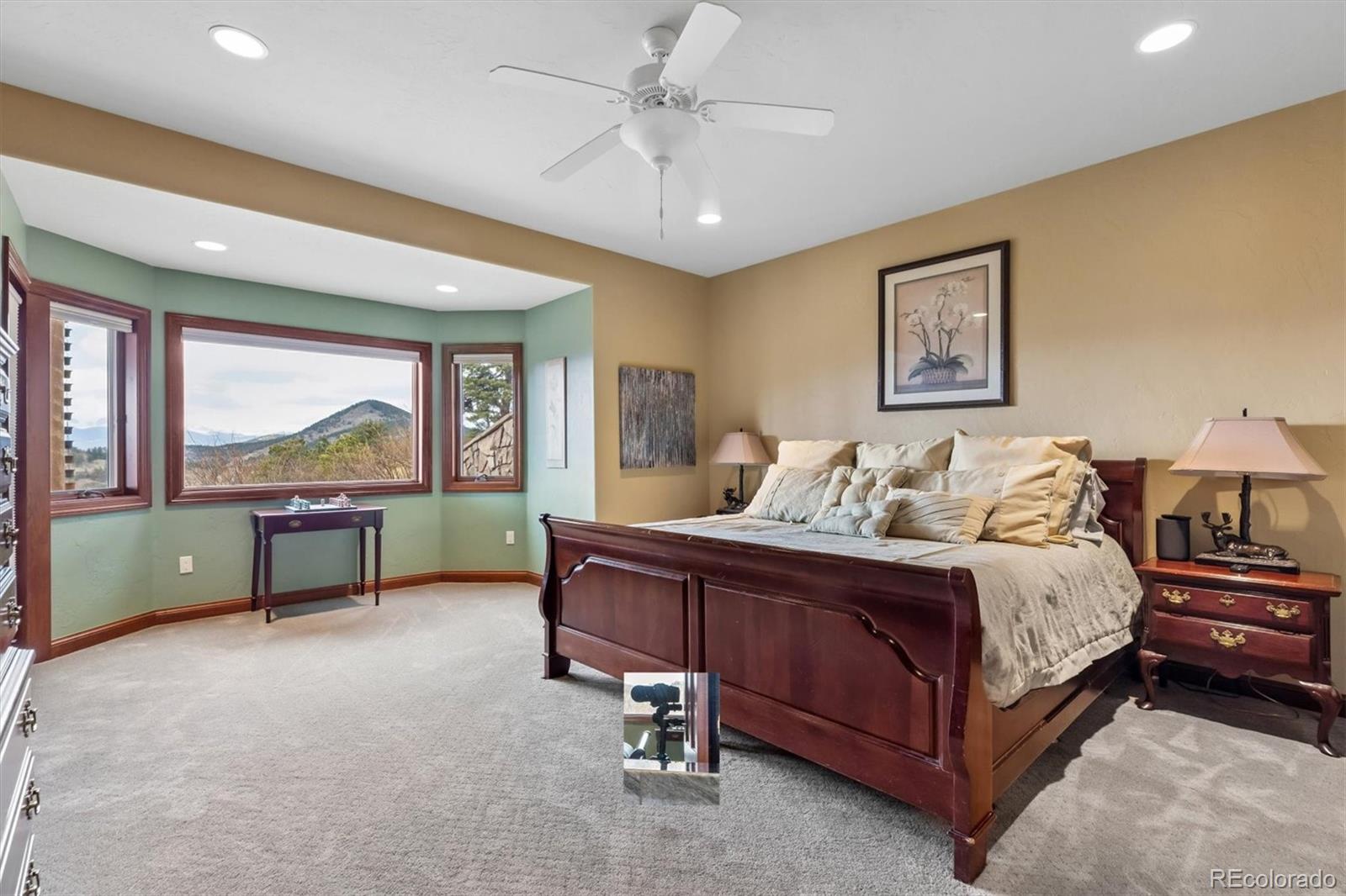 401 Raptor Point Golden, CO 80403 - Photo 46 of 48 a spacious bedroom with a bed and a large window