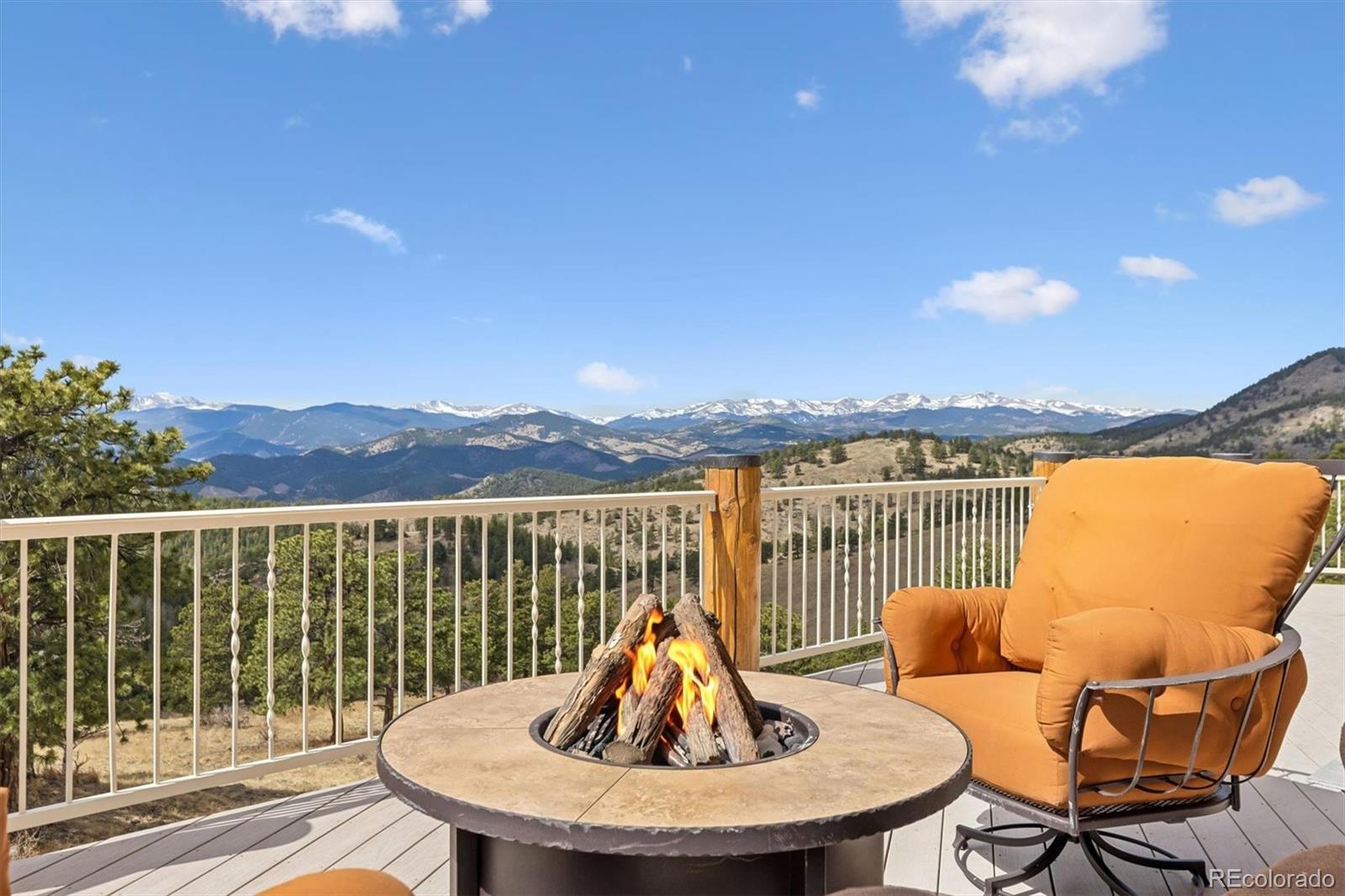 401 Raptor Point Golden, CO 80403 - Photo 8 of 48 a view of a balcony with a table and chairs
