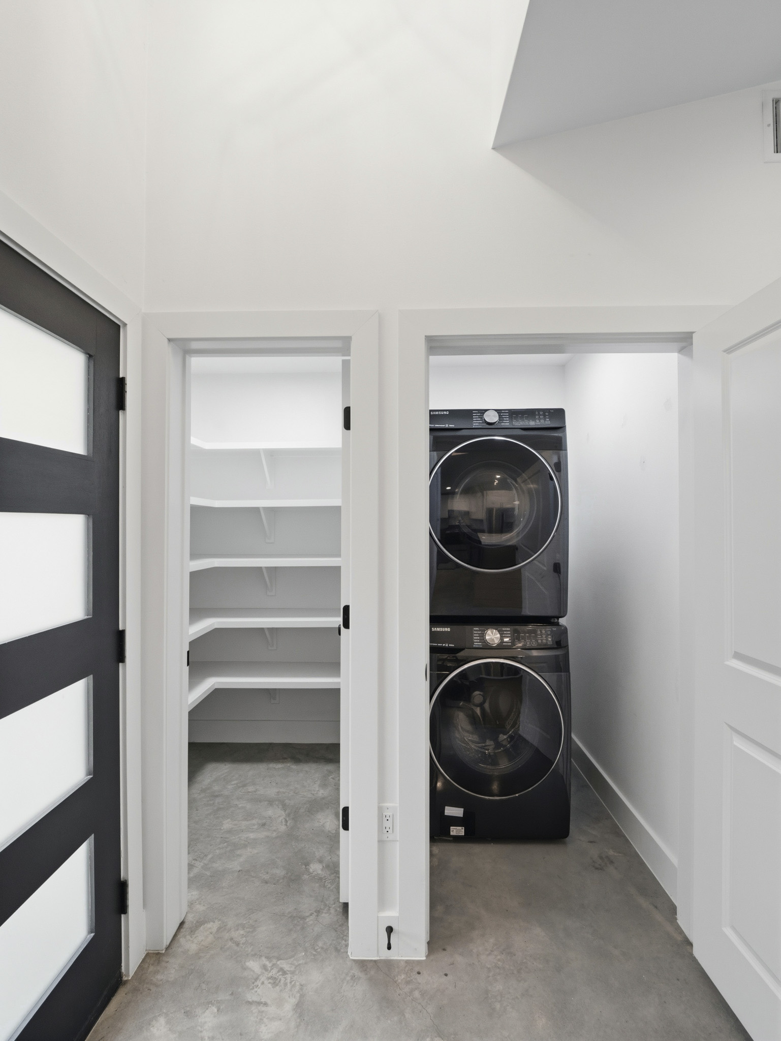 5005 Lott Avenue, Unit 2 Austin, TX 78721 - Photo 4 of 25 A well-appointed laundry area and pantry provide functional and convenient storage solutions.