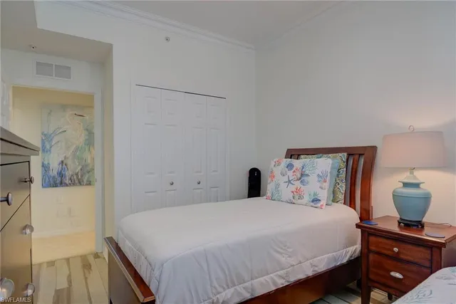 a bedroom with a bed and a cabinets