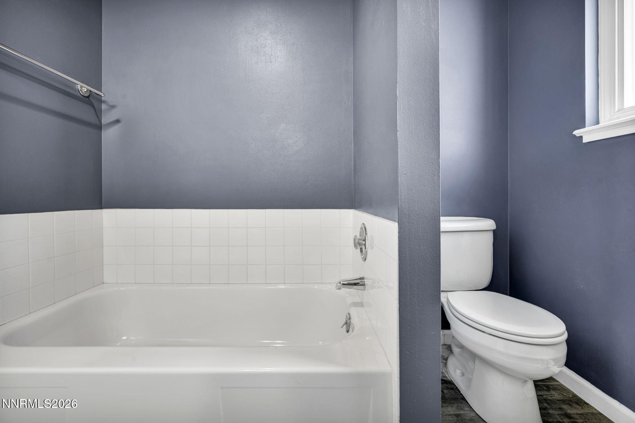 14190 Rim Rock Drive Reno, NV 89521 - Photo 36 of 68 a bathroom with a toilet and a bathtub
