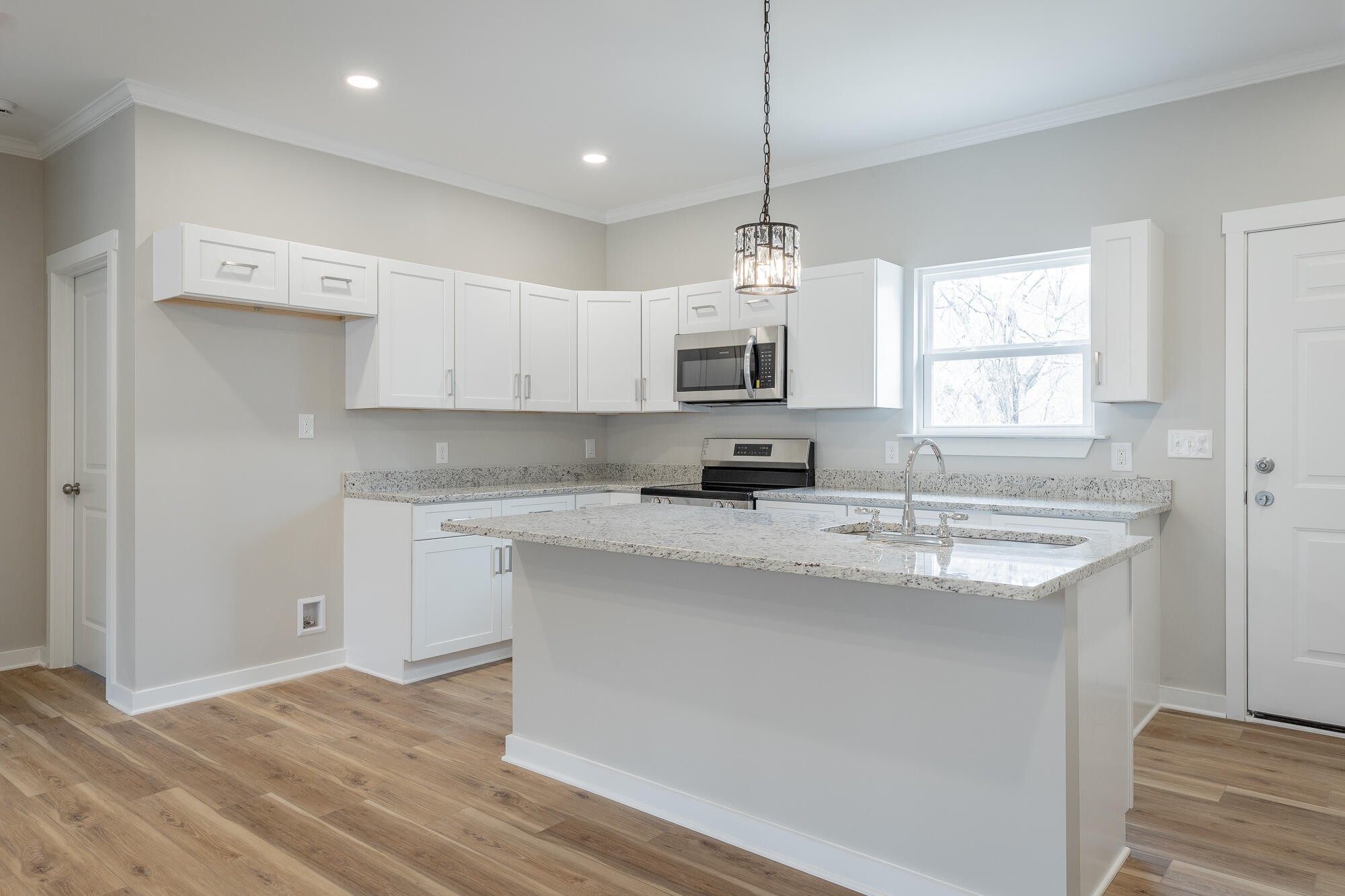 77 Pineway Circle Wildwood, GA 30757 - Photo 17 of 52 a kitchen with kitchen island granite countertop a sink appliances cabinets and a counter top space