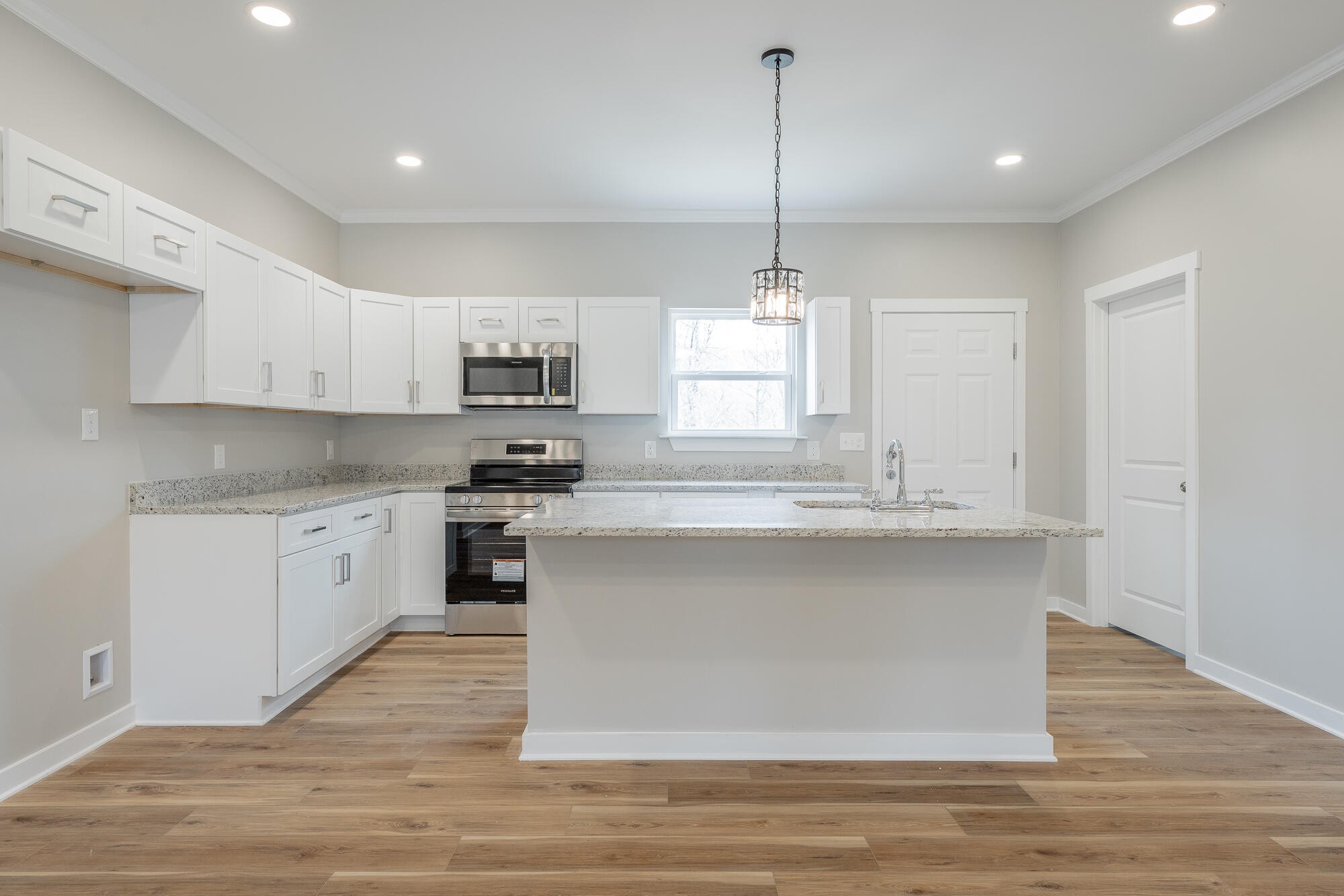 77 Pineway Circle Wildwood, GA 30757 - Photo 18 of 52 a kitchen with kitchen island granite countertop a stove a sink and a wooden floors