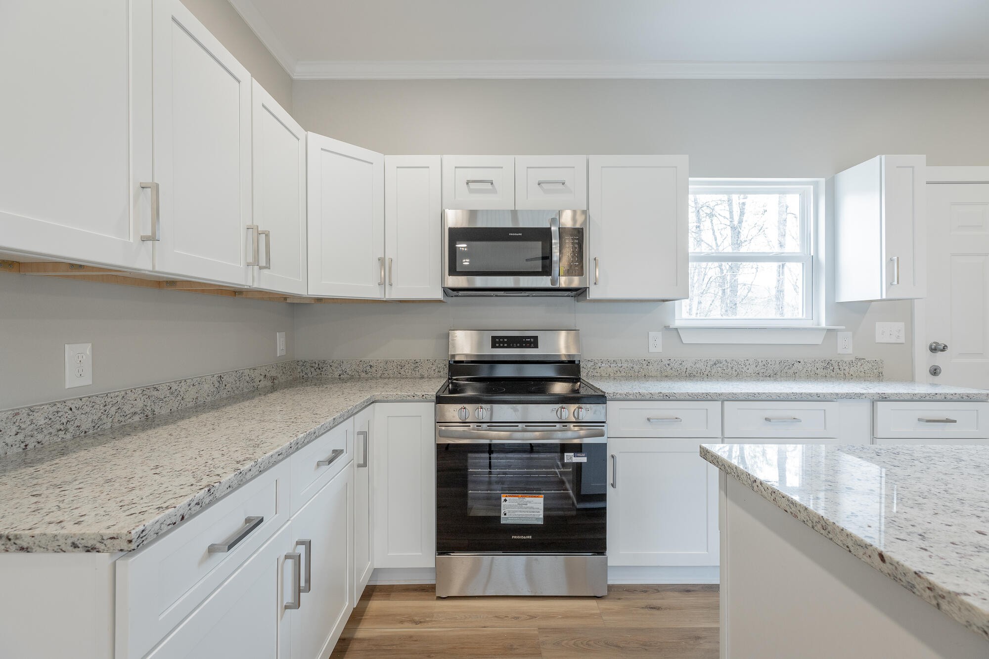 77 Pineway Circle Wildwood, GA 30757 - Photo 20 of 52 a kitchen with granite countertop a stove sink and microwave