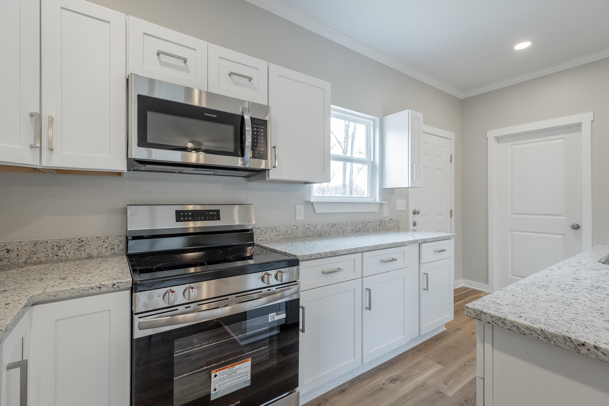 77 Pineway Circle Wildwood, GA 30757 - Photo 21 of 52 a kitchen with white cabinets appliances and a counter space