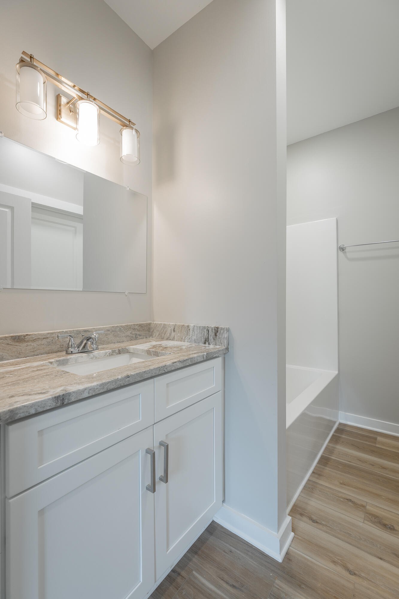 77 Pineway Circle Wildwood, GA 30757 - Photo 27 of 52 a bathroom with a granite countertop sink and a mirror