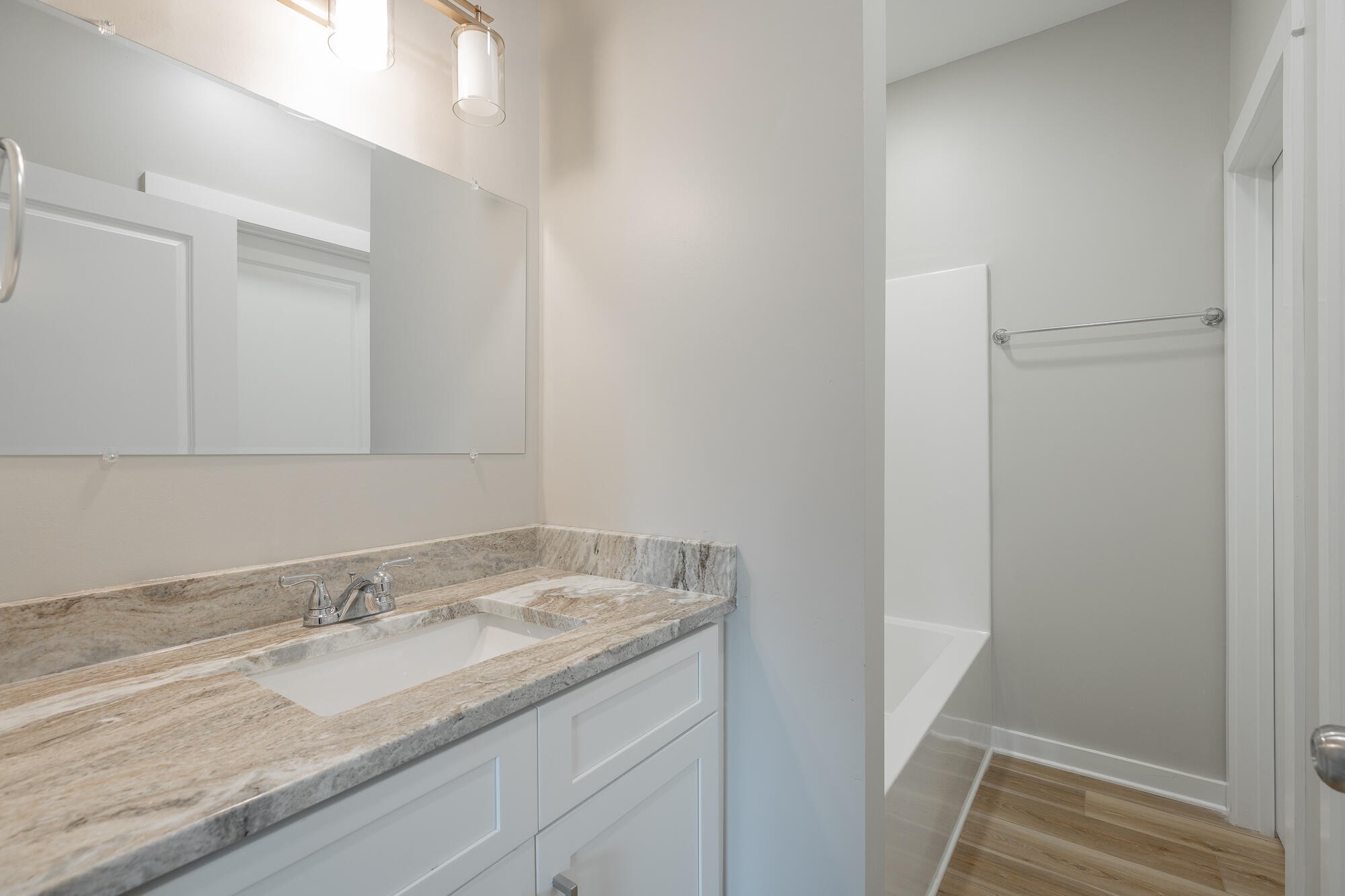 77 Pineway Circle Wildwood, GA 30757 - Photo 28 of 52 a bathroom with a granite countertop sink and a mirror