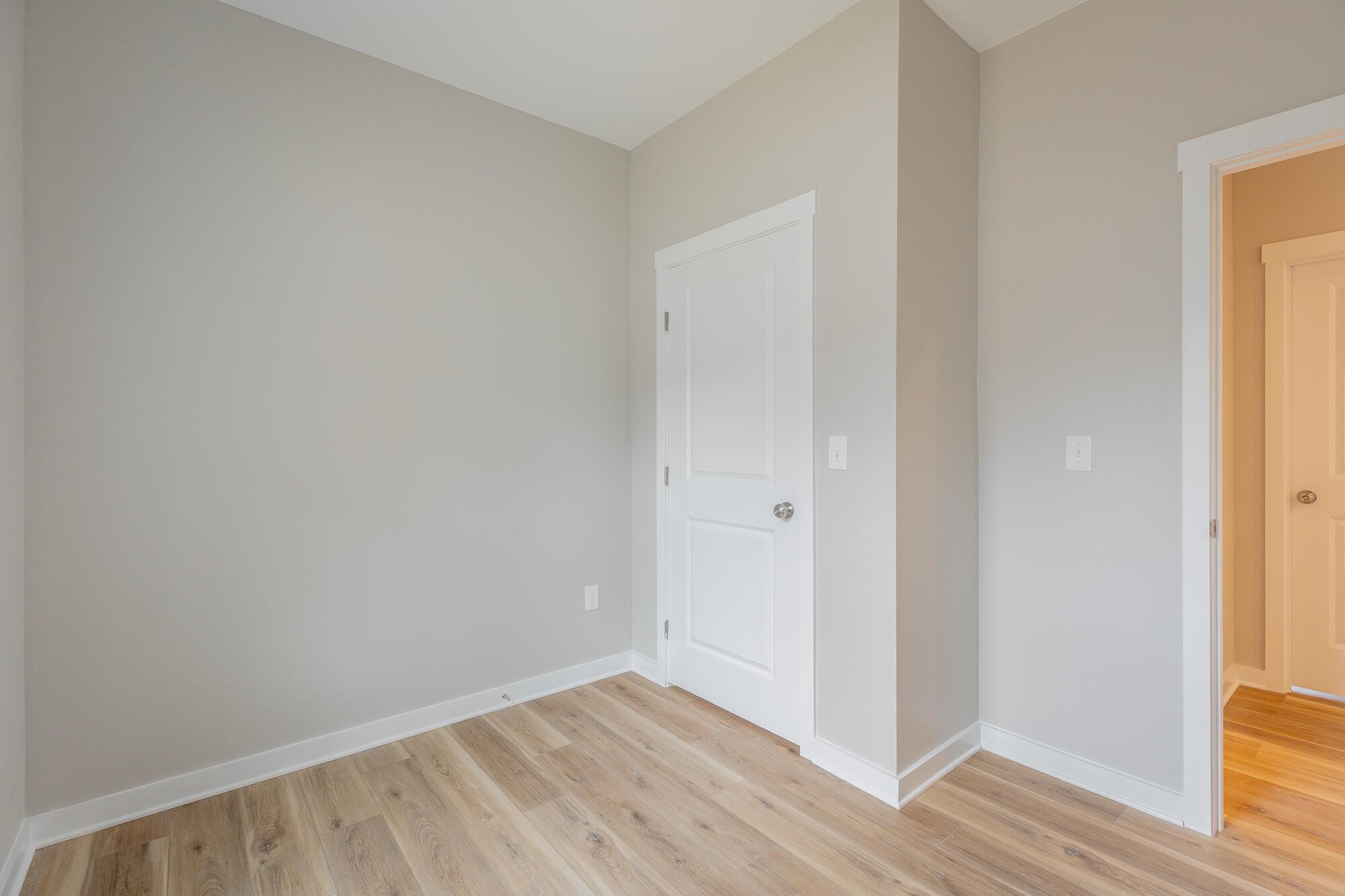 77 Pineway Circle Wildwood, GA 30757 - Photo 35 of 52 a view of an empty room with wooden floor and a window