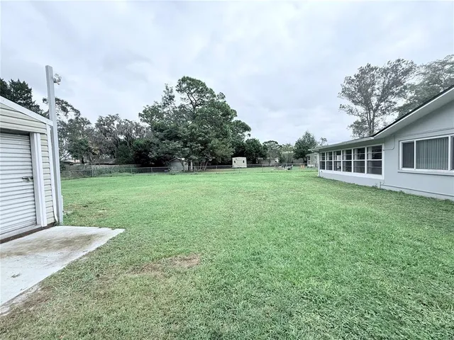 a backyard of a house with lots of green space