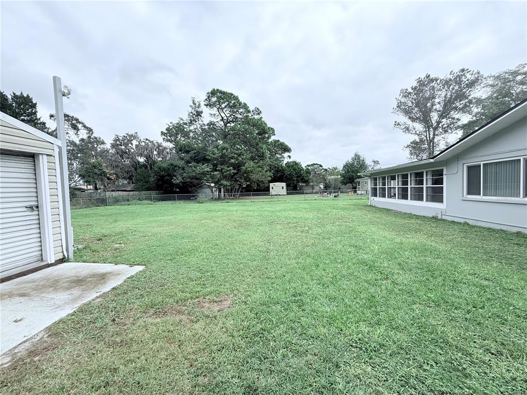 9733 Dick Street Hudson, FL 34669 - Photo 14 of 40 a view of a house with a backyard