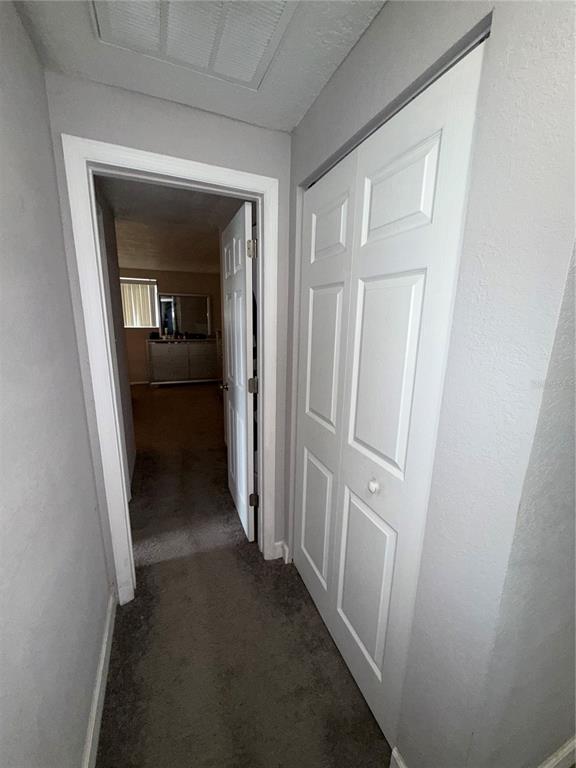 9733 Dick Street Hudson, FL 34669 - Photo 21 of 40 a view of a hallway and a livingroom with wooden floor