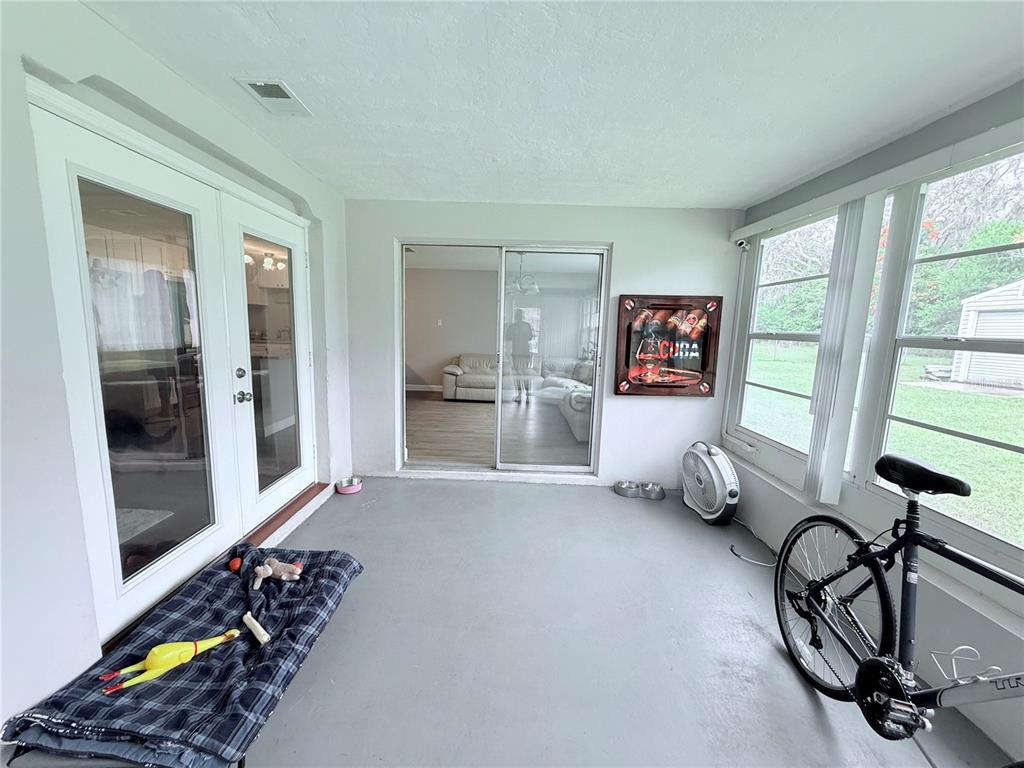 9733 Dick Street Hudson, FL 34669 - Photo 24 of 40 a living room with furniture and a window