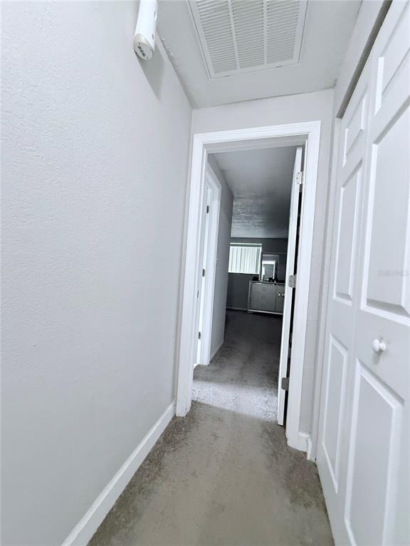 9733 Dick Street Hudson, FL 34669 - Photo 27 of 40 a view of a hallway with a room