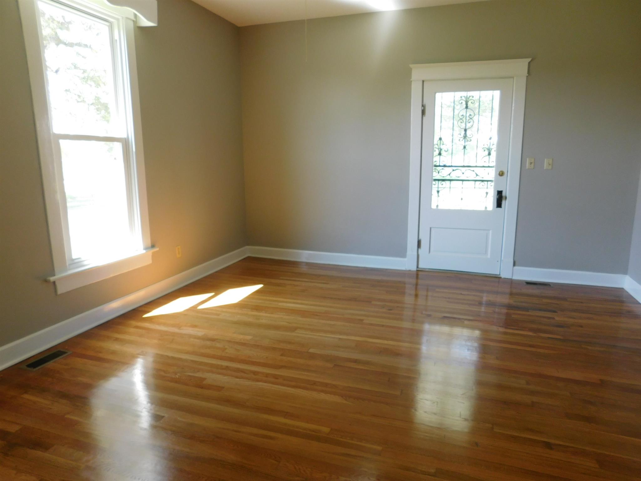 5447 Youngville Road Springfield, TN 37172 - Photo 5 of 30 a view of empty room with wooden floor and fan