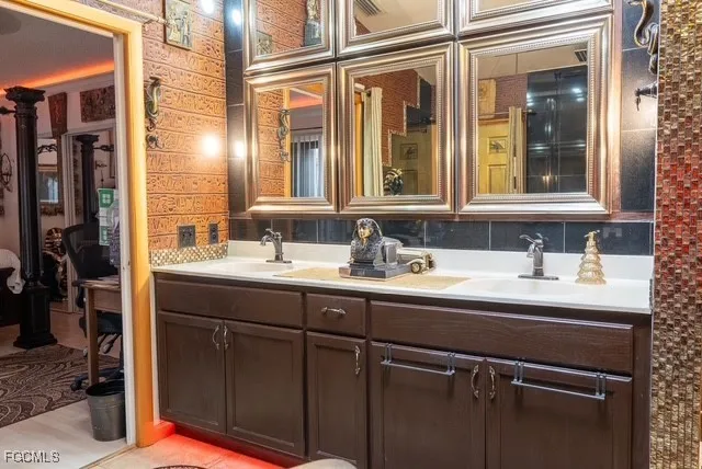 a view of a dining room with furniture wooden floor and a chandelier