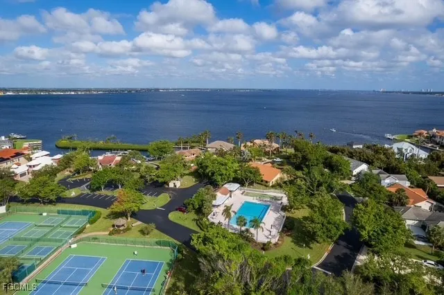 an aerial view of a swimming pool with seating space