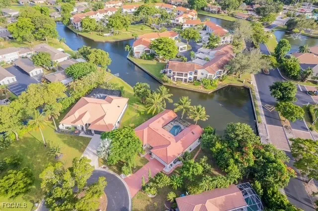 an aerial view of a residential houses with outdoor space