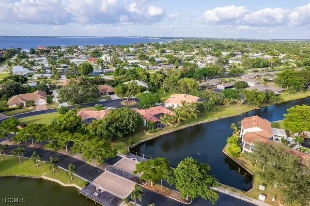 an aerial view of a house with a lake view
