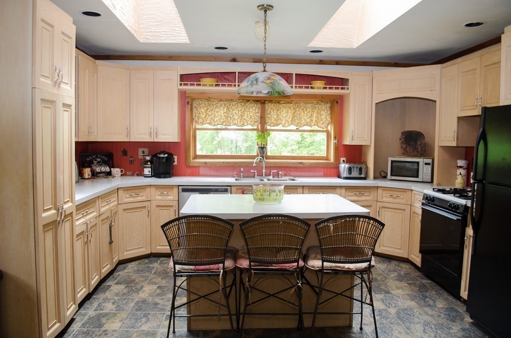 15 Dr Braley Road Rochester, MA 02770 - Photo 4 of 30 a kitchen with stainless steel appliances granite countertop a stove a sink and a refrigerator