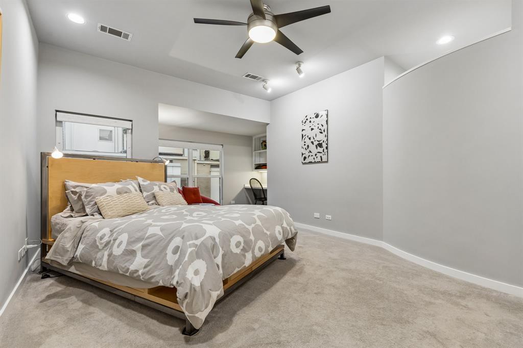 4139 Travis Street Dallas, TX 75204 - Photo 11 of 26 a bedroom with a bed and window