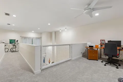 a view of a workspace with furniture