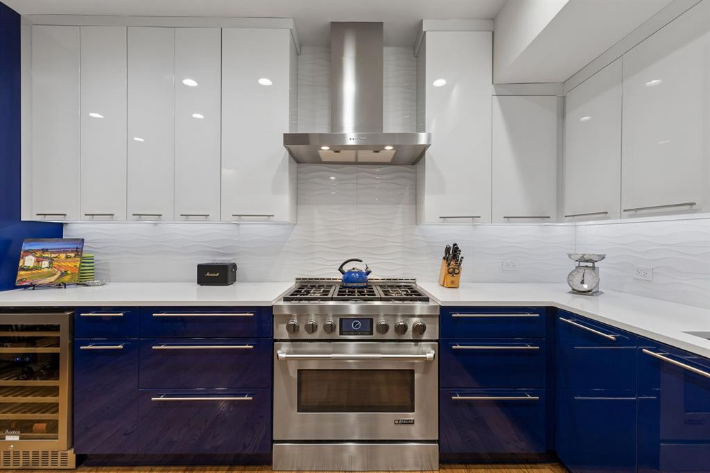 4139 Travis Street Dallas, TX 75204 - Photo 9 of 26 a kitchen with stainless steel appliances granite countertop a stove and a cabinets