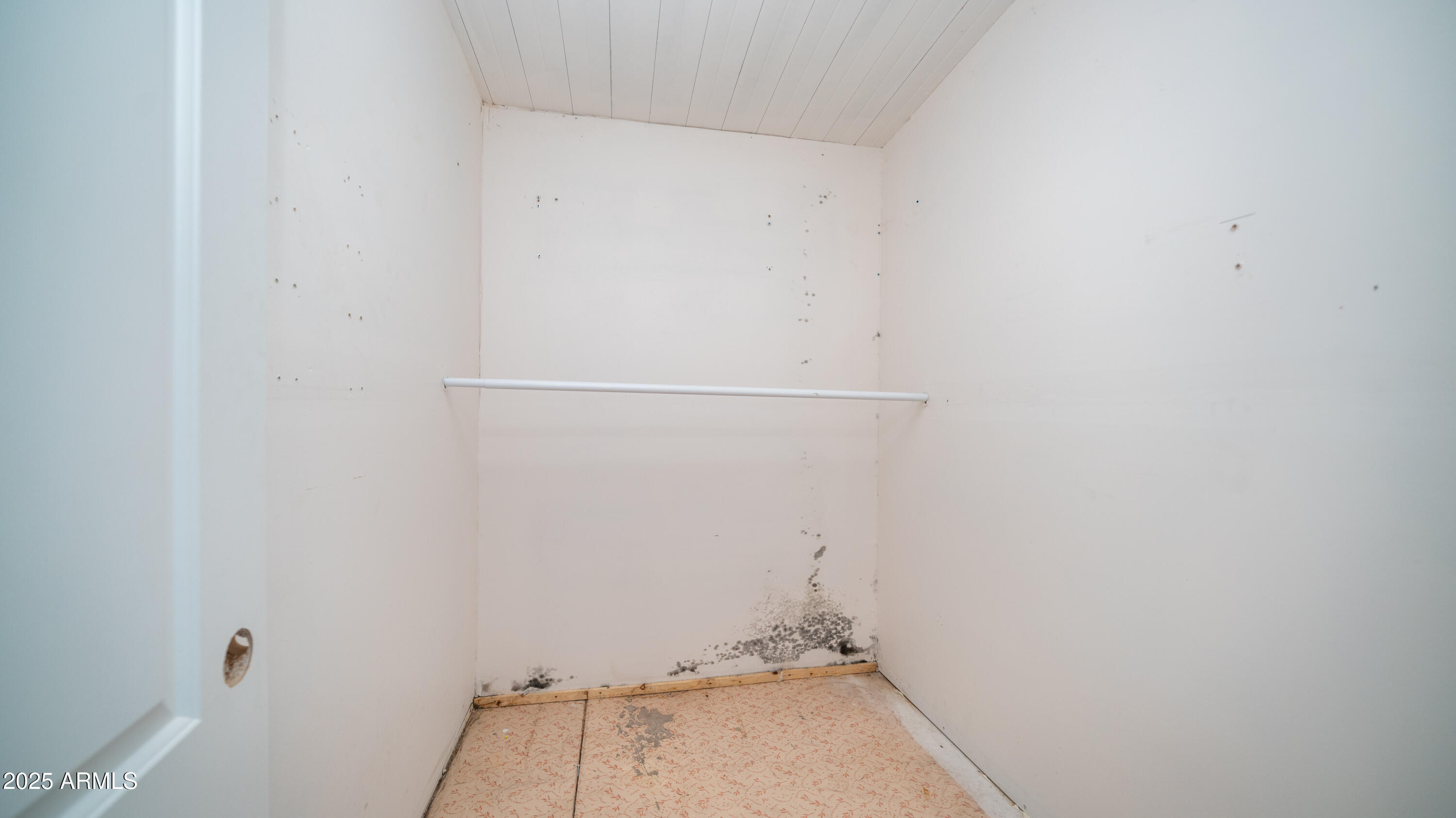 2359 South Tomahawk Road Apache Junction, AZ 85119 - Photo 13 of 32 a view of a room with racks on the wall