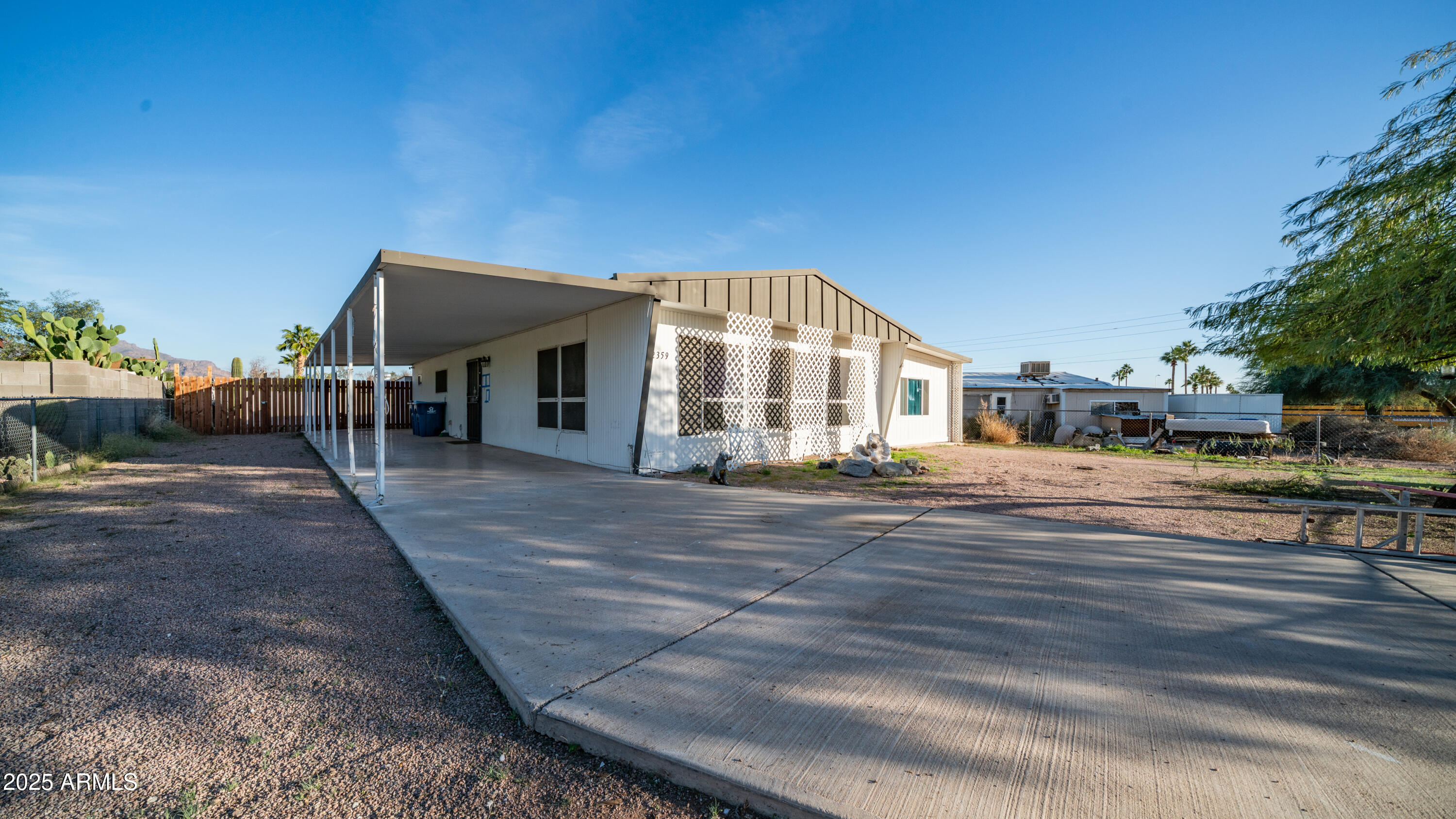 2359 South Tomahawk Road Apache Junction, AZ 85119 - Photo 2 of 32 a view of a house with a yard