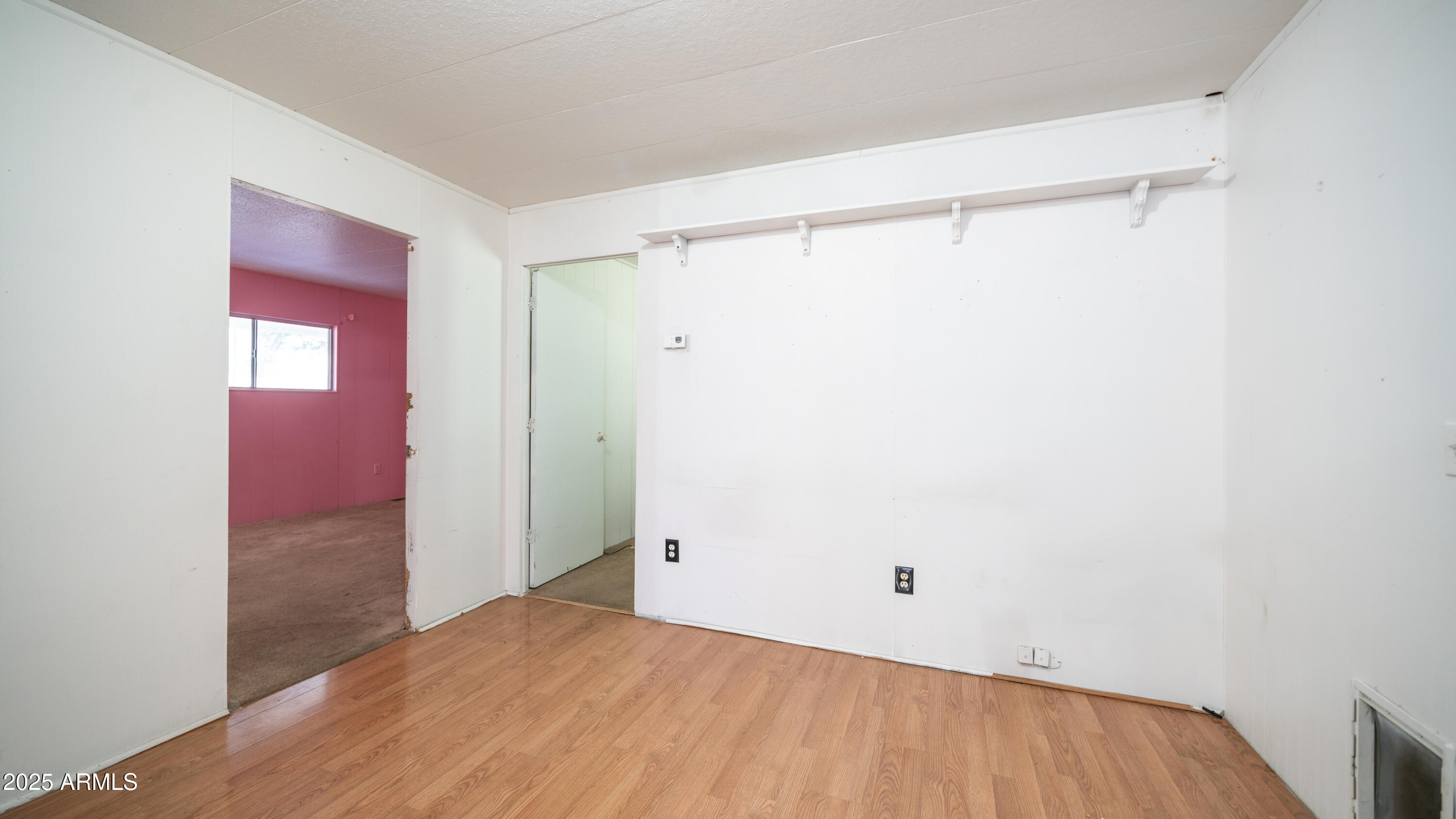 2359 South Tomahawk Road Apache Junction, AZ 85119 - Photo 9 of 32 a view of a room with an empty space